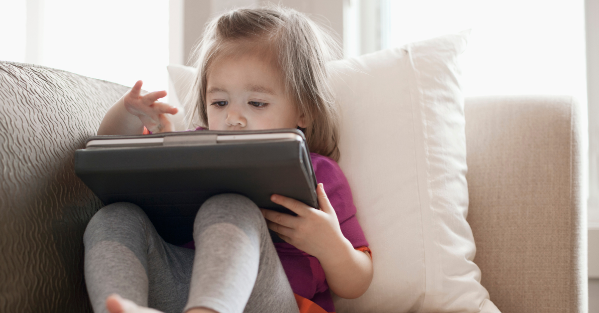 child playing with ipad